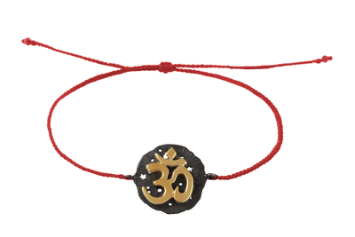 String bracelet with Om medallion amulet. Gold plated and oxide