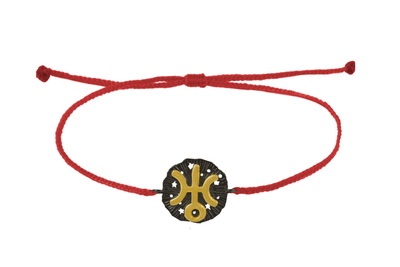 String bracelet with Uranus medallion amulet. Gold plated and oxide