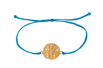 String bracelet with runic medallion amulet Fehu. Gold plated