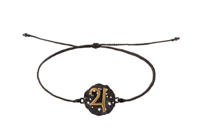 String bracelet with Jupiter medallion amulet. Gold plated and oxide