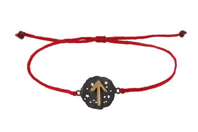 String bracelet with runic medallion amulet Tiwaz. Gold plated and oxide