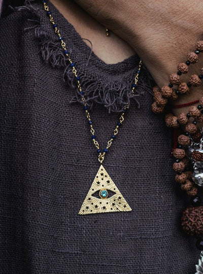 All-seeing-eye necklace on the chain with lapis lazuli. Gold plated